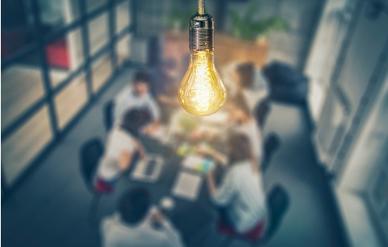 A light bulb hanging over a conference room in Commercial Office Spaces for Lease in Peoria IL
